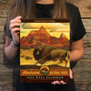 Woman holding our 2025 national park animals calendar