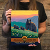 A woman holding our national park calendar